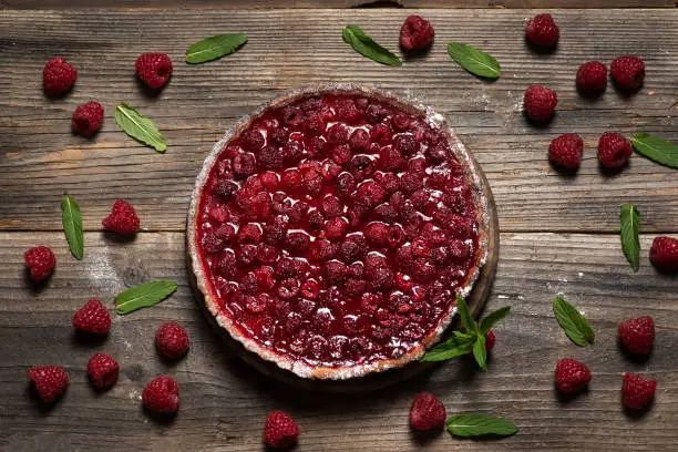 Artisan raspberry tart with micro mint
